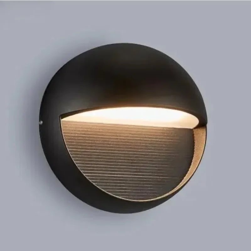 Linden round eyelid wall light in black