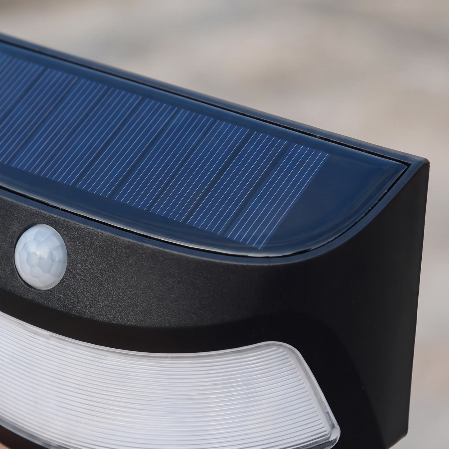 Close detail of the solar panel and motion sensor in black